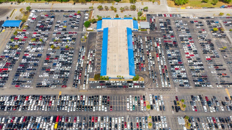 Aerial view of a Copart-style auction lot filled with vehicles awaiting transport